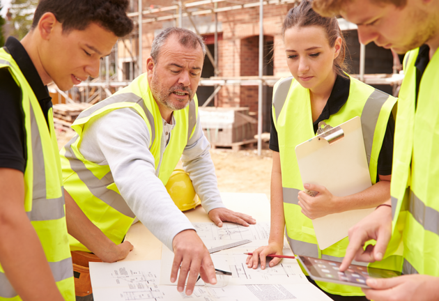 Builder looking over plans